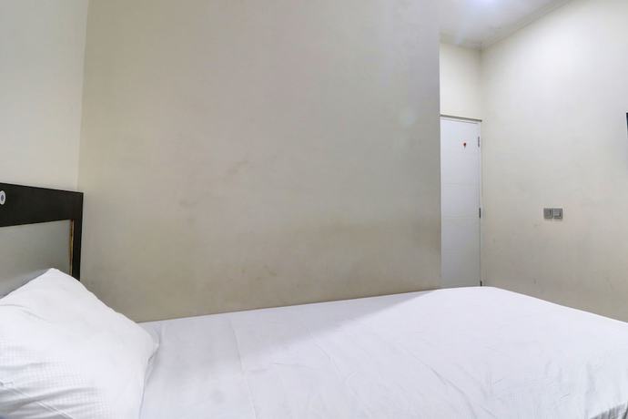 Imagen de la habitación del Hotel OYO Life 92707 D-akomiba Residence. Foto 5