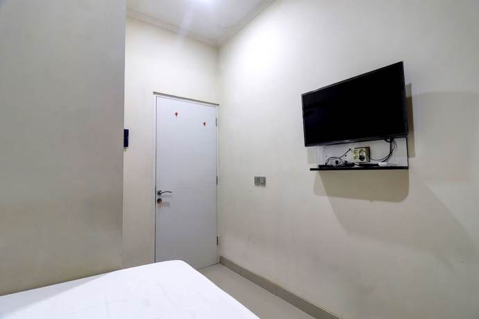 Imagen de la habitación del Hotel OYO Life 92707 D-akomiba Residence. Foto 9