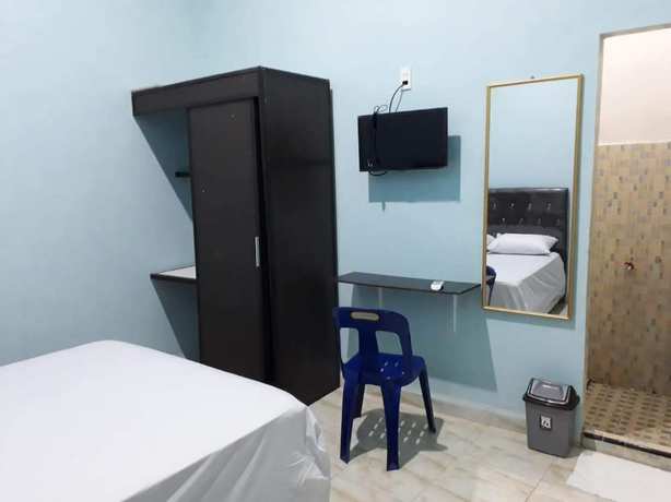 Imagen de la habitación del Hotel OYO Life 92780 Kost Bara. Foto 11