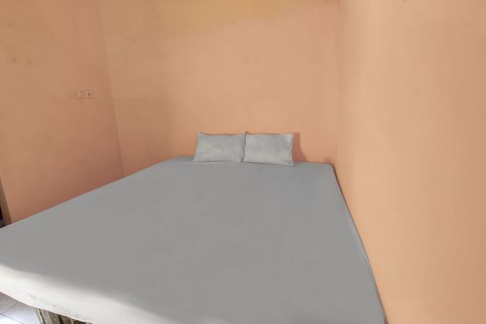 Imagen de la habitación del Hotel OYO Life 92846 Kost Putra Griya Eka. Foto 11