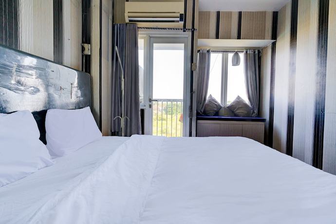 Imagen de la habitación del Hotel OYO Life 92874 Apartement Grand Sentraland Karawang By Red Dragon. Foto 7