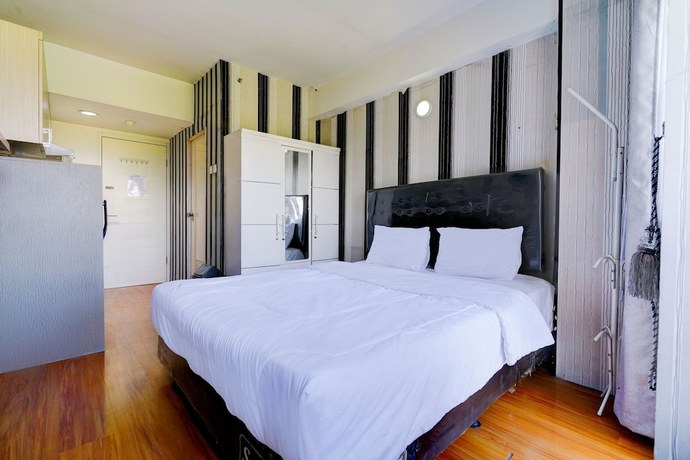 Imagen de la habitación del Hotel OYO Life 92874 Apartement Grand Sentraland Karawang By Red Dragon. Foto 9