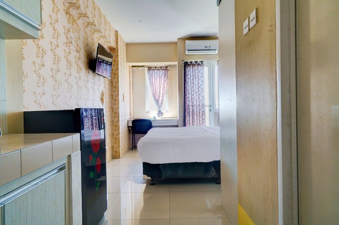 Imagen de la habitación del Hotel OYO Life 92874 Apartement Grand Sentraland Karawang By Red Dragon. Foto 11