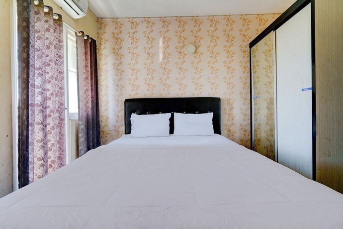 Imagen de la habitación del Hotel OYO Life 92874 Apartement Grand Sentraland Karawang By Red Dragon. Foto 13