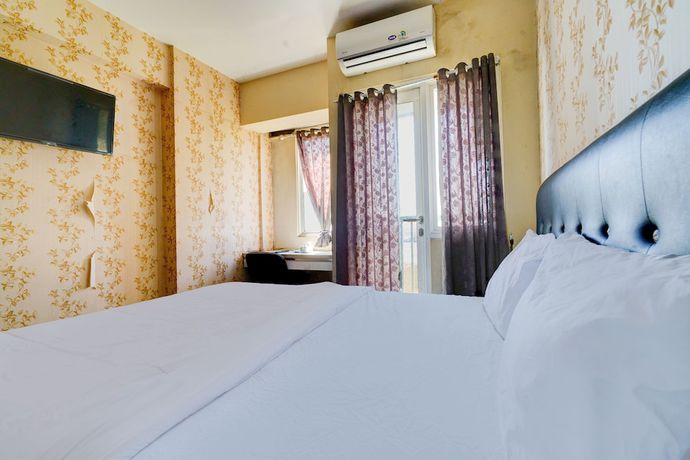 Imagen de la habitación del Hotel OYO Life 92874 Apartement Grand Sentraland Karawang By Red Dragon. Foto 14