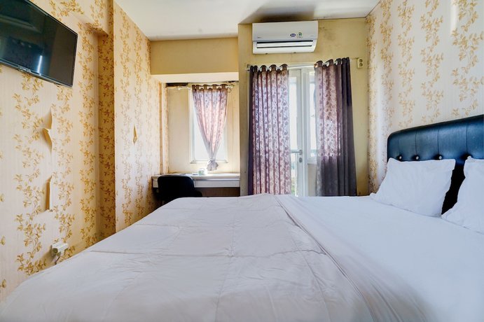 Imagen de la habitación del Hotel OYO Life 92874 Apartement Grand Sentraland Karawang By Red Dragon. Foto 15