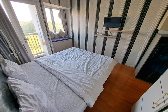 Imagen de la habitación del Hotel OYO Life 93106 Apartement Grand Sentraland By Andi. Foto 16
