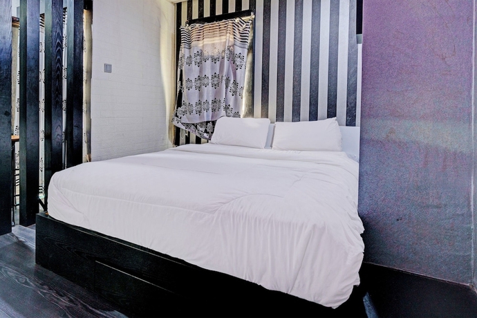 Imagen de la habitación del Hotel OYO Life 93120 Apartement Gateway Cicadas By Sarana Cipta Mahakarya. Foto 4