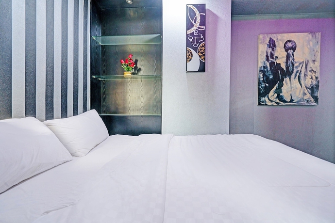 Imagen de la habitación del Hotel OYO Life 93120 Apartement Gateway Cicadas By Sarana Cipta Mahakarya. Foto 10