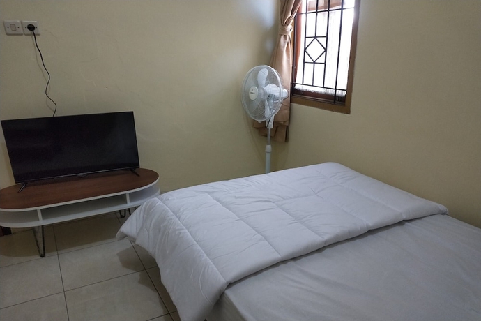Imagen de la habitación del Hotel OYO Life 93257 Kos Anugerah. Foto 4
