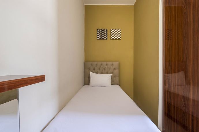 Imagen de la habitación del Hotel OYO Living 1877 Side Corner. Foto 4