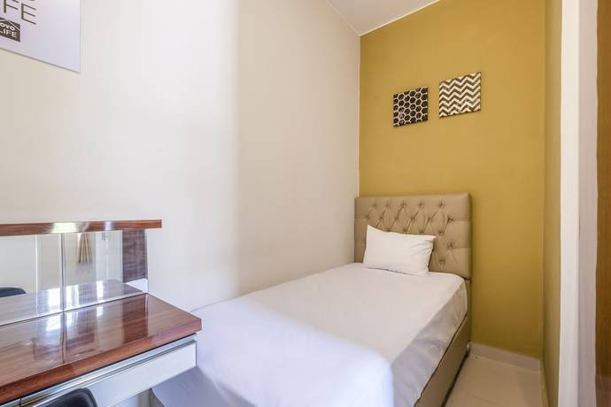 Imagen de la habitación del Hotel OYO Living 1877 Side Corner. Foto 5