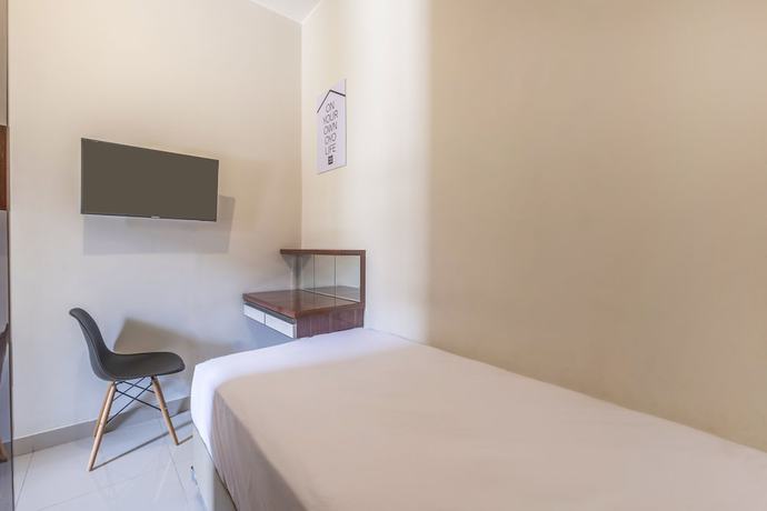 Imagen de la habitación del Hotel OYO Living 1877 Side Corner. Foto 10