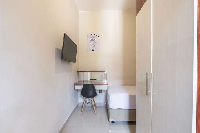 Imagen de la habitación del Hotel OYO Living 1877 Side Corner. Foto 13