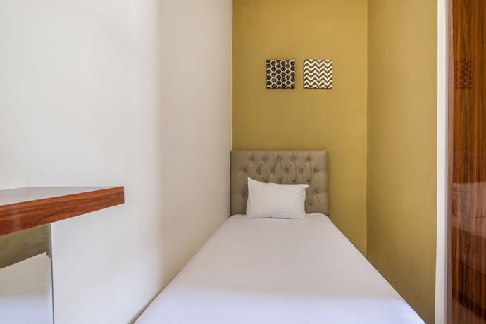 Imagen de la habitación del Hotel OYO Living 1877 Side Corner. Foto 14