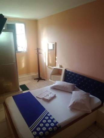 Imagen de la habitación del Hotel OYO Macedo. Foto 3