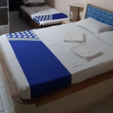 Imagen de la habitación del Hotel OYO Macedo. Foto 4