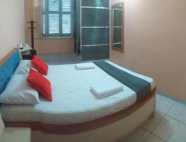 Imagen de la habitación del Hotel OYO Macedo. Foto 8