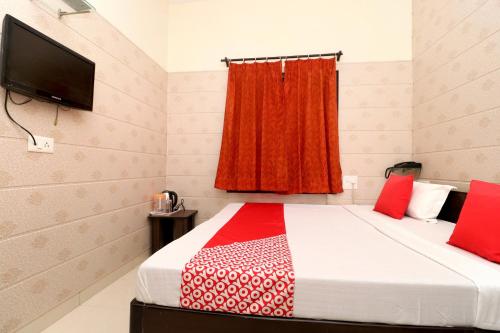 Imagen de la habitación del Hotel OYO Mall Residency. Foto 19