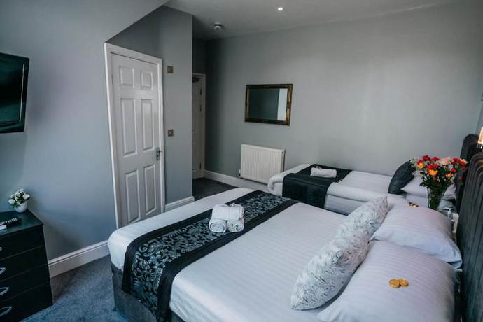 Imagen de la habitación del Hotel OYO Minerva Guesthouse. Foto 3