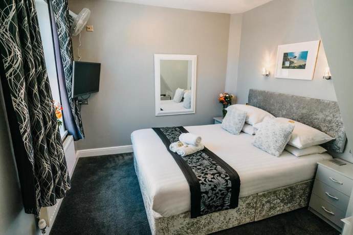 Imagen de la habitación del Hotel OYO Minerva Guesthouse. Foto 5