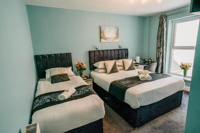 Imagen de la habitación del Hotel OYO Minerva Guesthouse. Foto 7