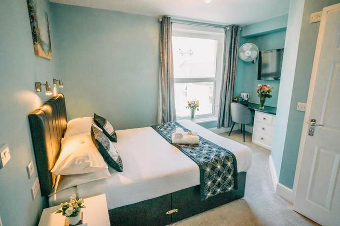 Imagen de la habitación del Hotel OYO Minerva Guesthouse. Foto 9