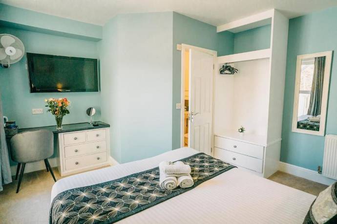 Imagen de la habitación del Hotel OYO Minerva Guesthouse. Foto 10