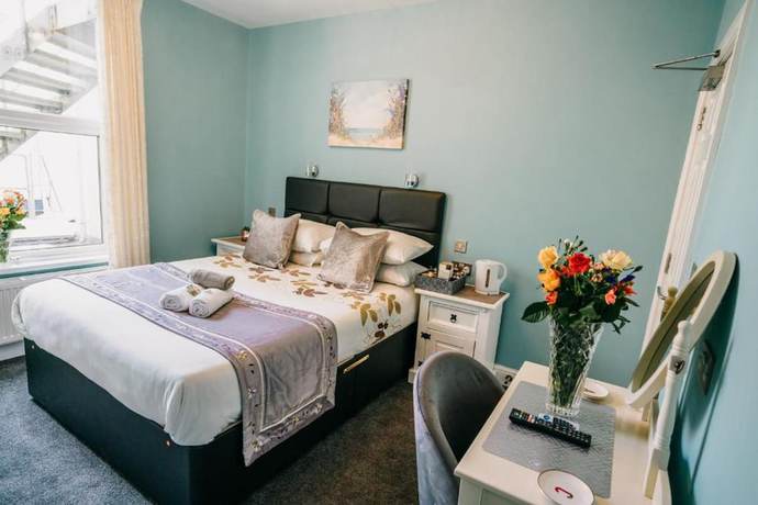 Imagen de la habitación del Hotel OYO Minerva Guesthouse. Foto 11