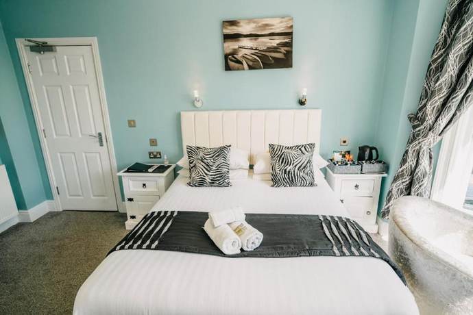 Imagen de la habitación del Hotel OYO Minerva Guesthouse. Foto 12