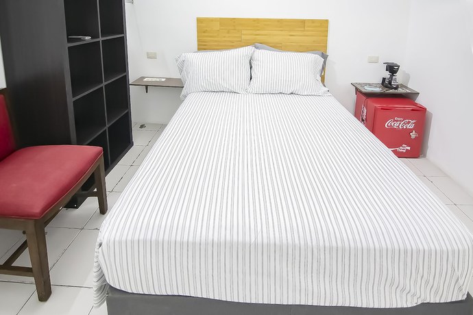 Imagen de la habitación del Hotel OYO Plaza Las Torres, Cabo San Lucas. Foto 8