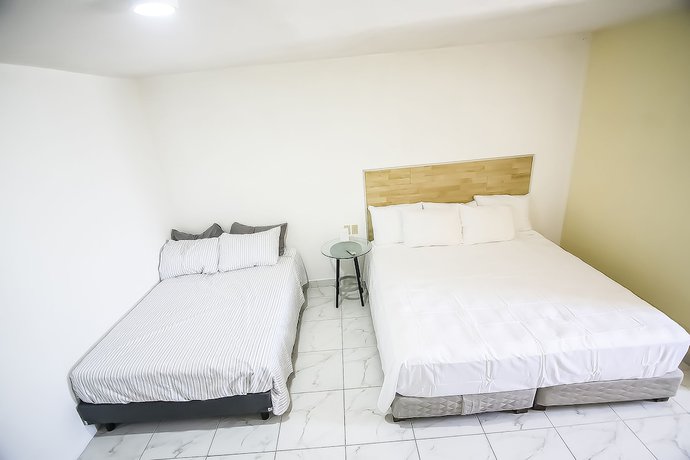 Imagen de la habitación del Hotel OYO Plaza Las Torres, Cabo San Lucas. Foto 12