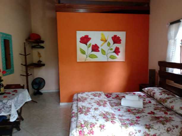 Imagen de la habitación del Hotel OYO Pousada Luar da Serra Lumiar. Foto 6