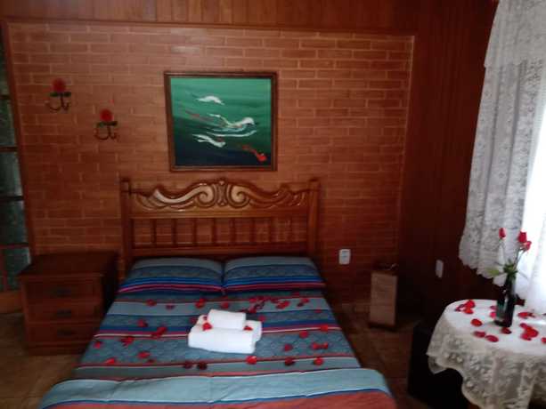 Imagen de la habitación del Hotel OYO Pousada Luar da Serra Lumiar. Foto 14