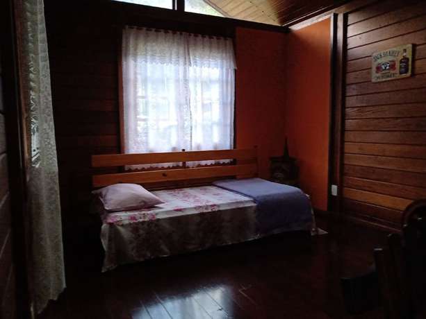 Imagen de la habitación del Hotel OYO Pousada Luar da Serra Lumiar. Foto 16