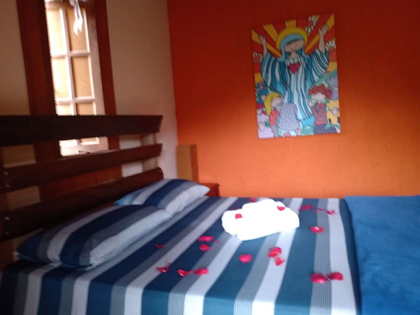 Imagen de la habitación del Hotel OYO Pousada Luar da Serra Lumiar. Foto 18