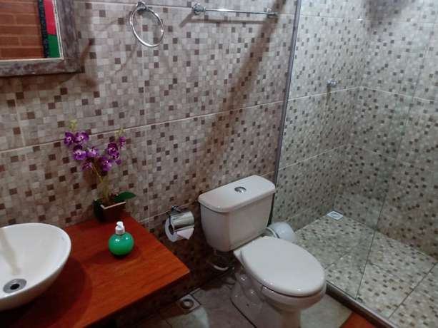 Imagen de la habitación del Hotel OYO Pousada Luar da Serra Lumiar. Foto 19