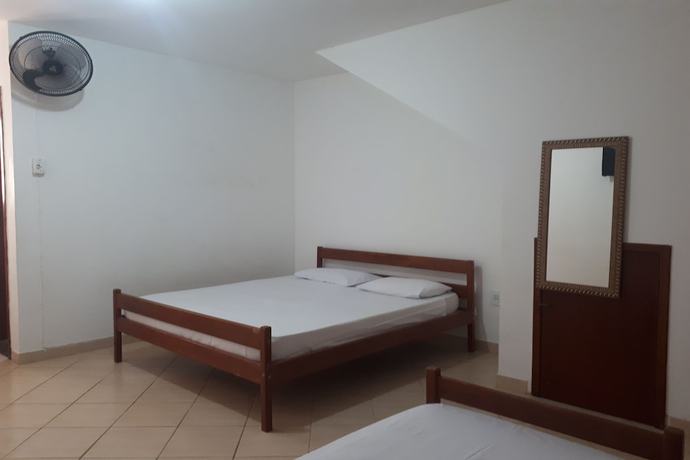 Imagen de la habitación del Hotel OYO Pousada Para&iacute;so. Foto 4
