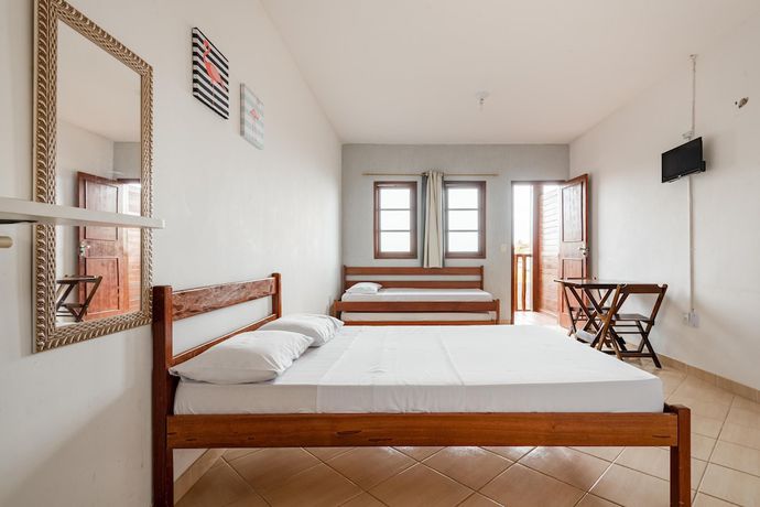 Imagen de la habitación del Hotel OYO Pousada Para&iacute;so. Foto 5