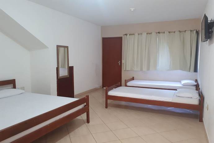 Imagen de la habitación del Hotel OYO Pousada Para&iacute;so. Foto 7
