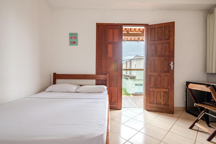 Imagen de la habitación del Hotel OYO Pousada Para&iacute;so. Foto 11