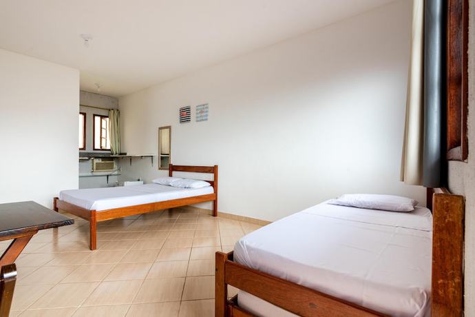 Imagen de la habitación del Hotel OYO Pousada Para&iacute;so. Foto 13