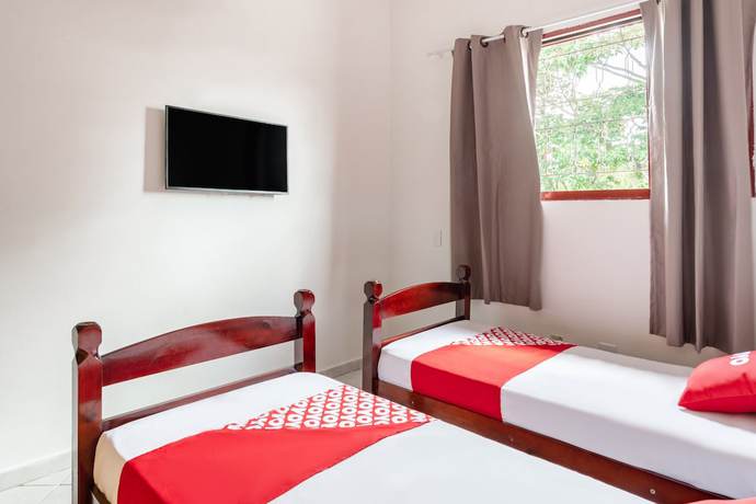 Imagen de la habitación del Hotel OYO Pousada Tia L&eacute;o Campinas, Bar&atilde;o Geraldo. Foto 11