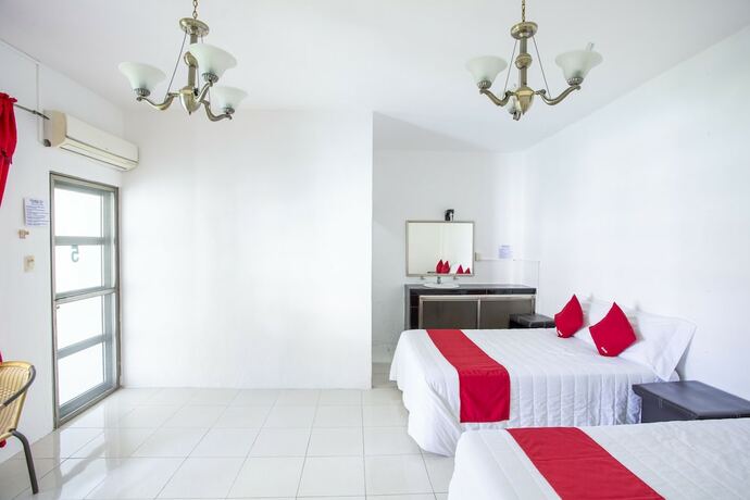 Imagen de la habitación del Hotel OYO Rio. Foto 18