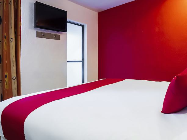 Imagen de la habitación del Hotel OYO SR92. Foto 6