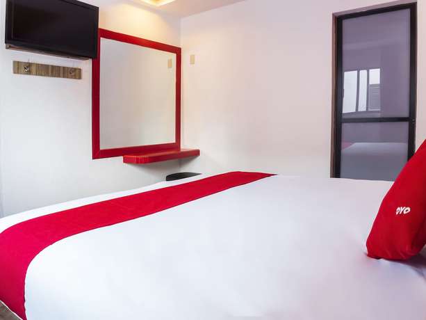 Imagen de la habitación del Hotel OYO SR92. Foto 11