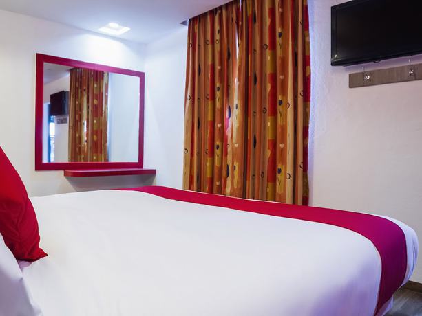 Imagen de la habitación del Hotel OYO SR92. Foto 14