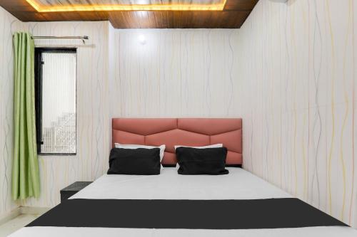 Imagen de la habitación del Hotel OYO S.S tower. Foto 20