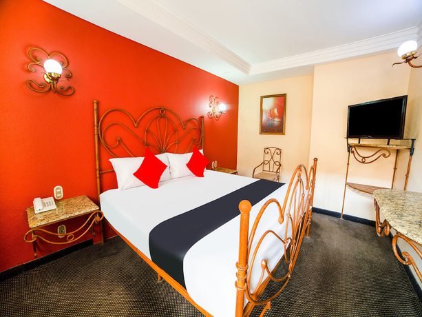 Imagen de la habitación del Hotel OYO Santa María. Foto 2