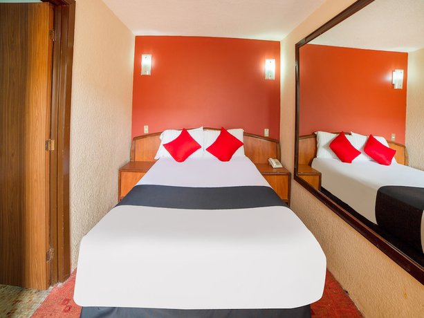 Imagen de la habitación del Hotel OYO Santa María. Foto 11